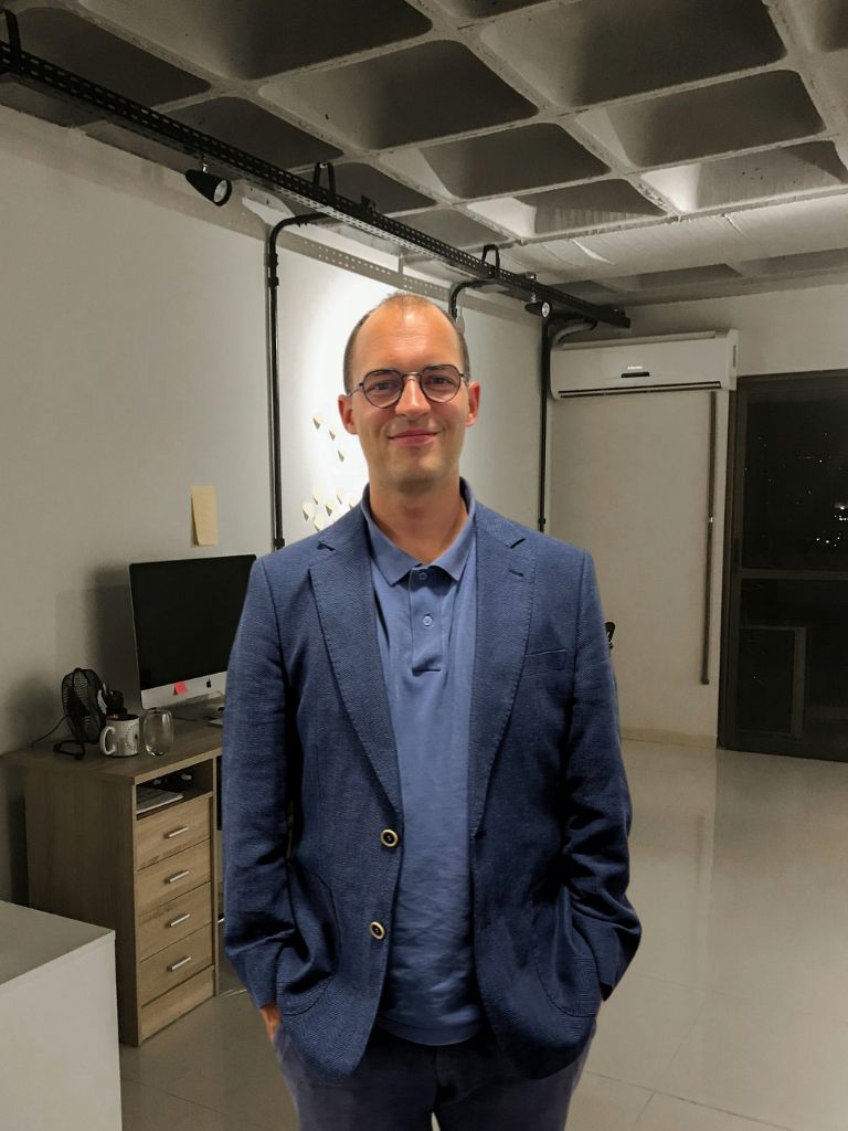Photo of Maciej Smoleński in the office